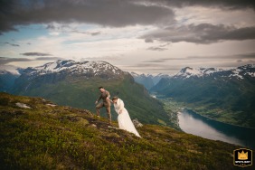 Bride and groom walking back up from the mountain after their ceremony in Loen, Norway.